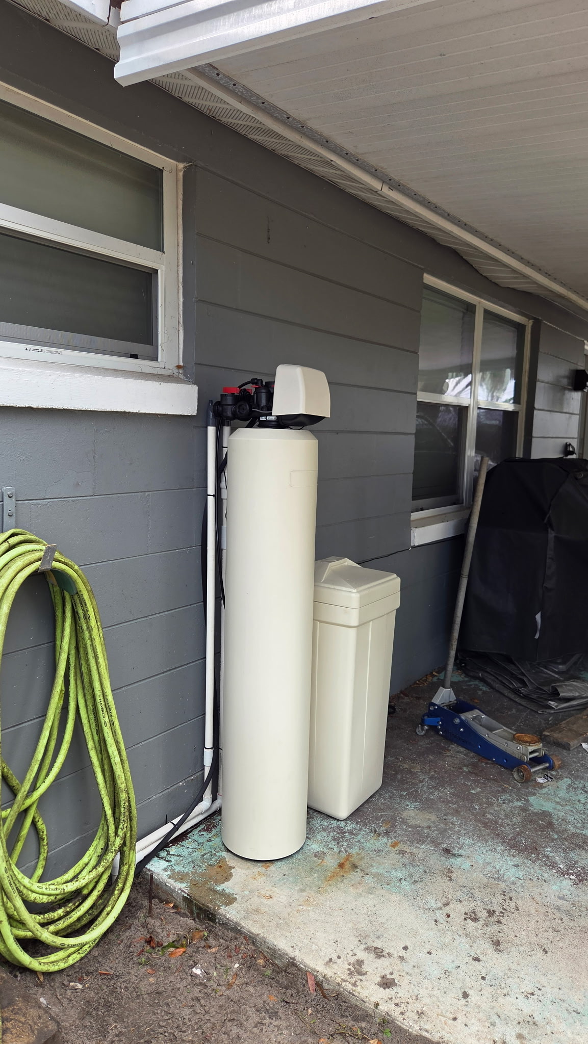 HydroOne water treatment system installed outside a Central Florida home