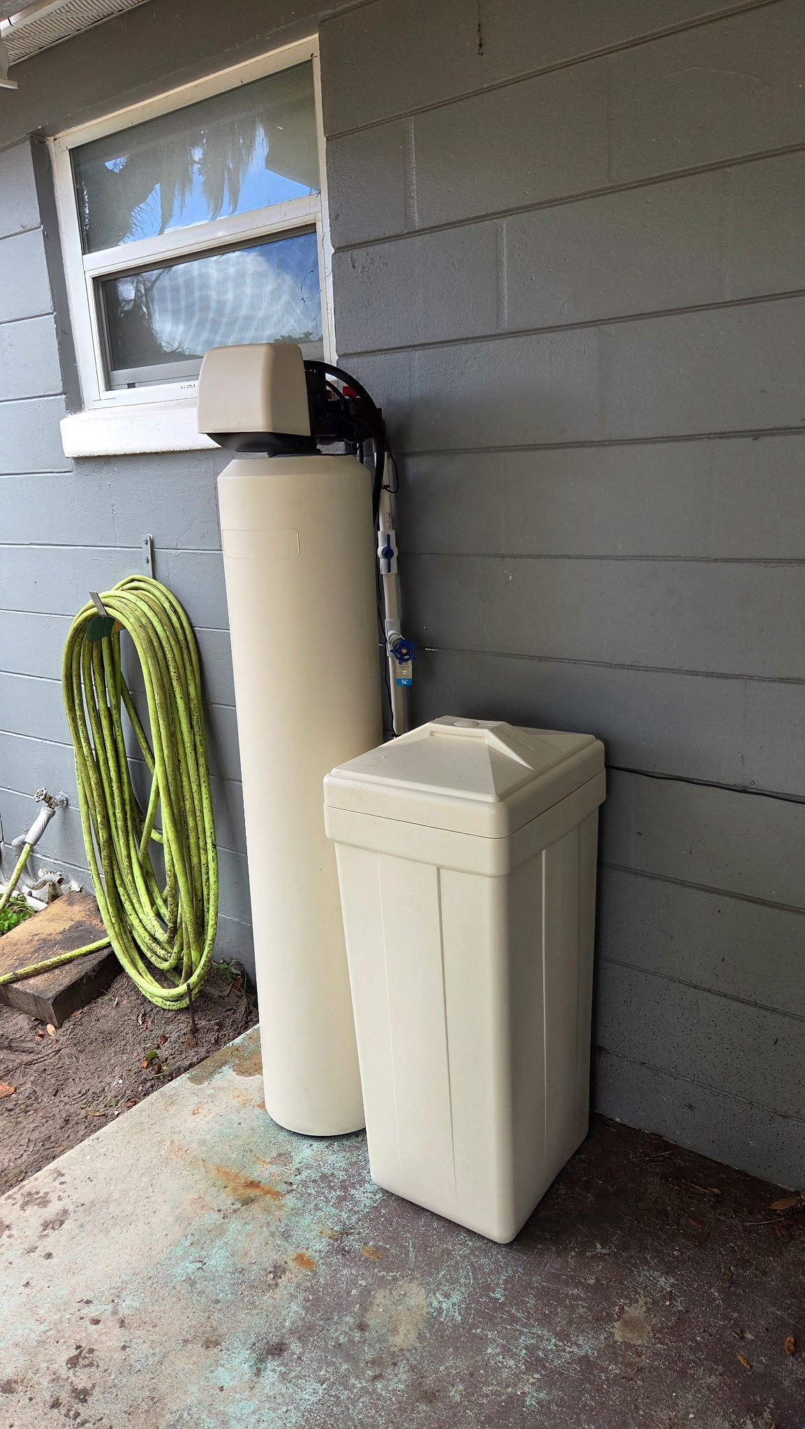 HydroOne water filter and softener installed outside a home