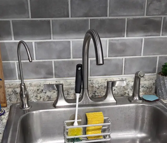 Drinking-water faucet at a stainless-steel sink