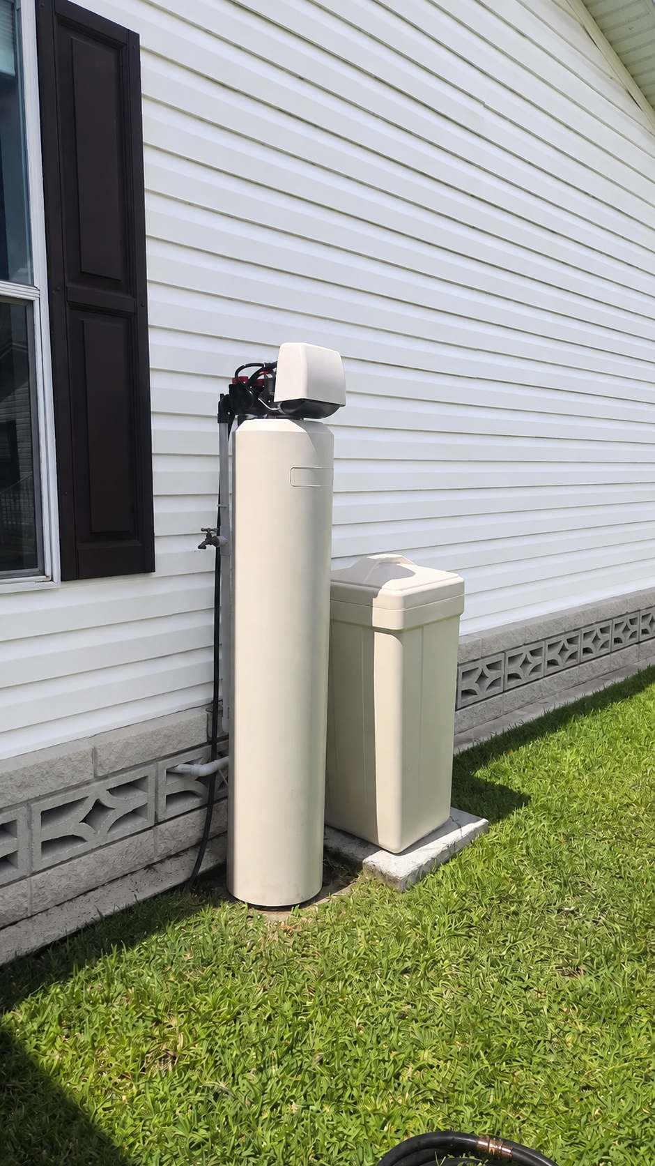 A Sunstorm whole-home treatment system installed beside a home