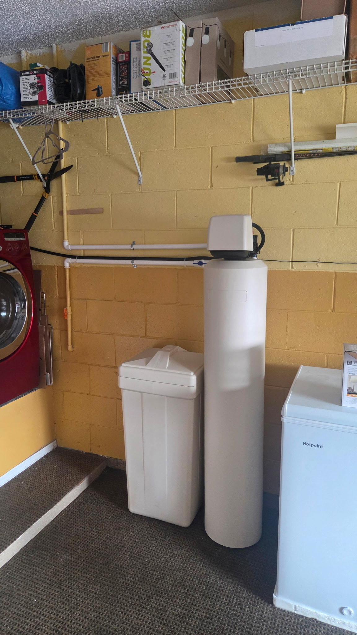 HydroOne water treatment system installed in a garage